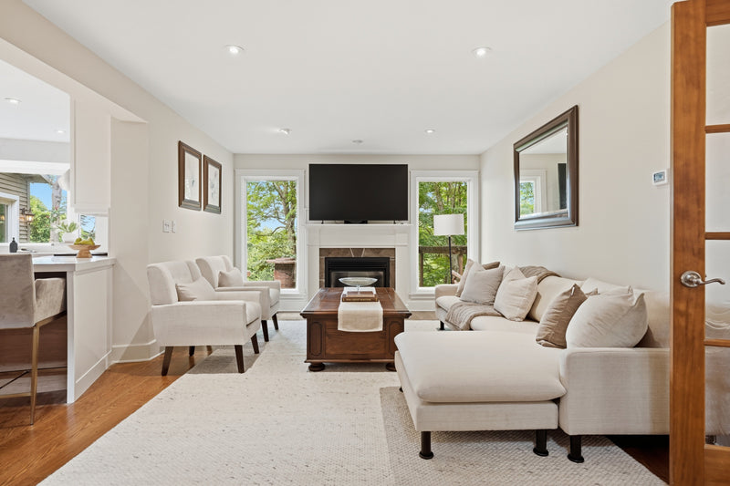 A beautifully scaled living room with well-positioned furniture arranged to create an inviting, balanced, and harmonious home interior