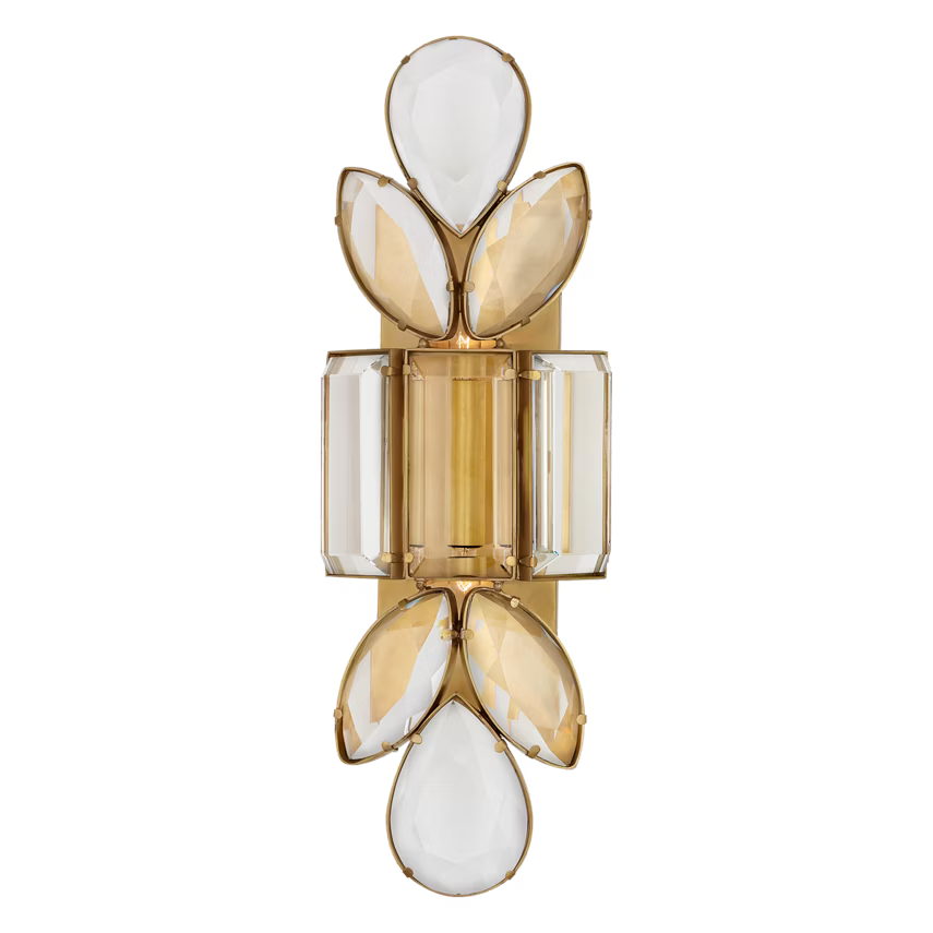 Decorative wall sconce with gold, white, and clear glass elements on a black background
